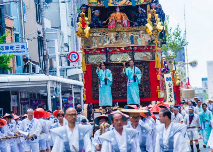 The famous Gion Matsuri in Kyoto, with an eye-catching shrine being carried along in a parade.